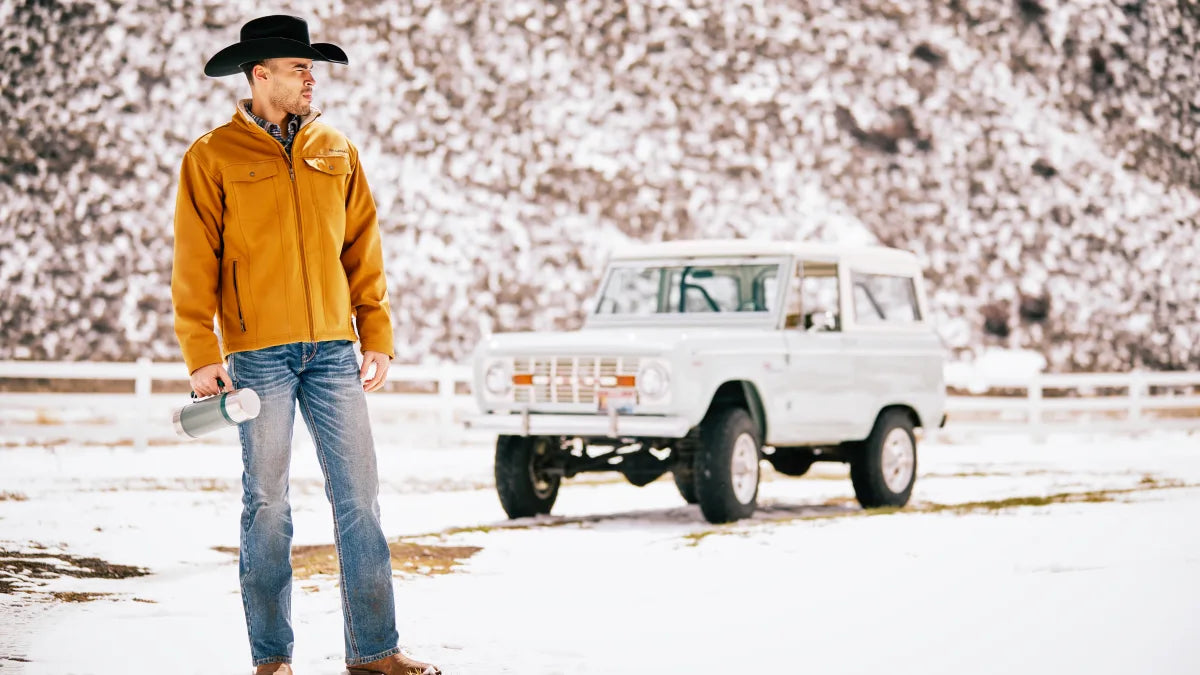 Complete winter western outfit with boots, jacket, hat, and jeans from The Cowboy Shop