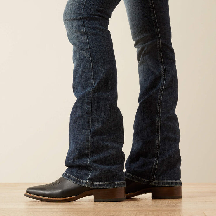 Esti Boot Cut Jeans styled over cowboy boots for riding