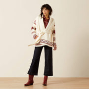 Model wearing Ariat Westward Wrap Women’s Sweater Cream Southwest Print styled with jeans