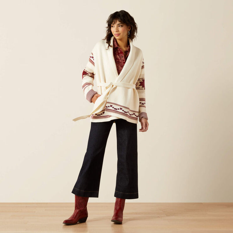 Model wearing Ariat Westward Wrap Women’s Sweater Cream Southwest Print styled with jeans