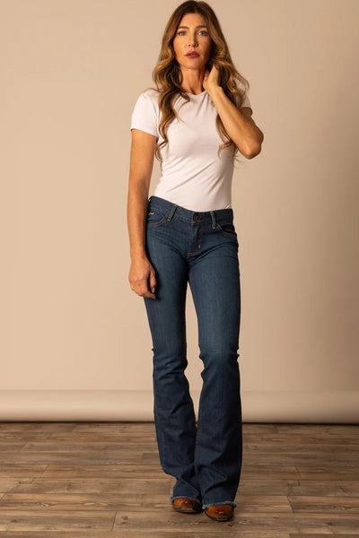 Model wearing Kimes Ranch Lola Raw Hem Wide Flare Leg Jeans
