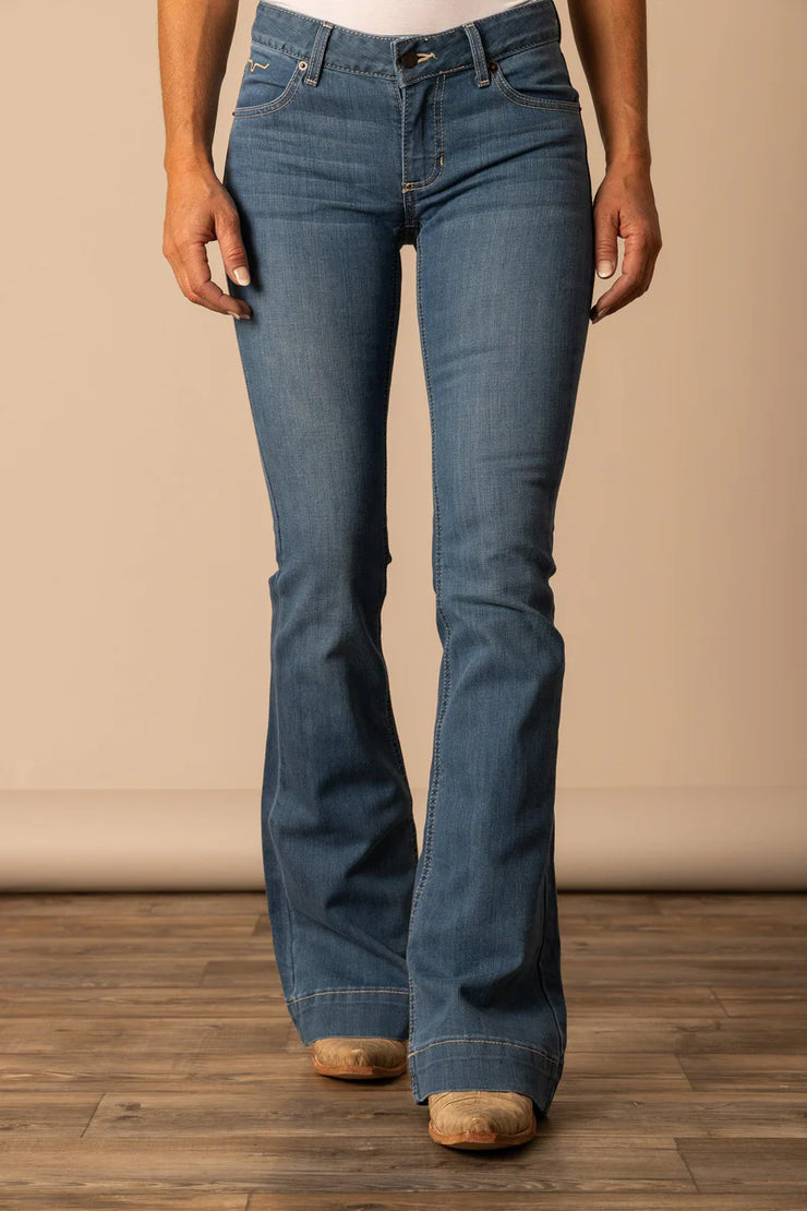 Kimes Ranch Lola Soho Fade Mid-Rise Jeans worn over cowgirl boots